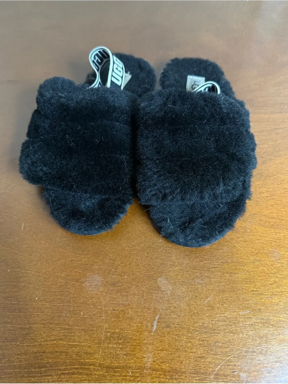 UGG Kids Black Fuzzy Slippers with Branded Strap
